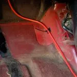 Securing the cabling in the passenger footwell
