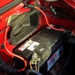 The cable routing and fuse holder under the bonnet