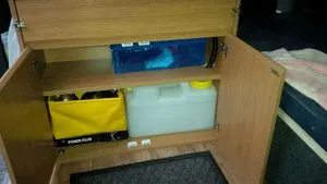 The two tanks, fresh and waste water in the lower compartment