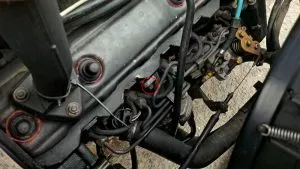 The location of the top bolt of the brake vacuum pump