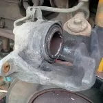 The piston pushed back, into the caliper