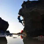 Andy traverses a still pool of water