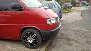 Parked hanging over the kerb, gives enough clearance under the engine