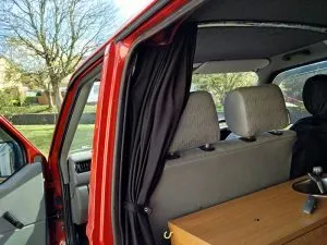 The curtains open, and held in position by the tie backs