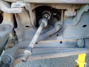 With the steering gaiter and tie rod end removed