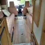 Wood effect flooring replaces the pink carpet