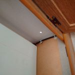 The hole in the roof for the cable - inside an overhead locker