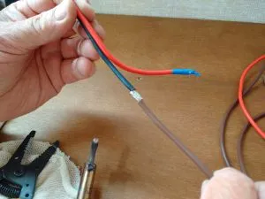 Extending the solar panel cables by soldering in a new length of wire