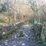 An old pack horse bridge over the river Bovey
